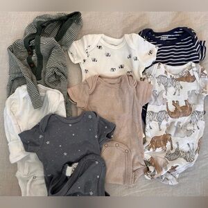 100% Cotton. 7 onesies. Size 0-3 months